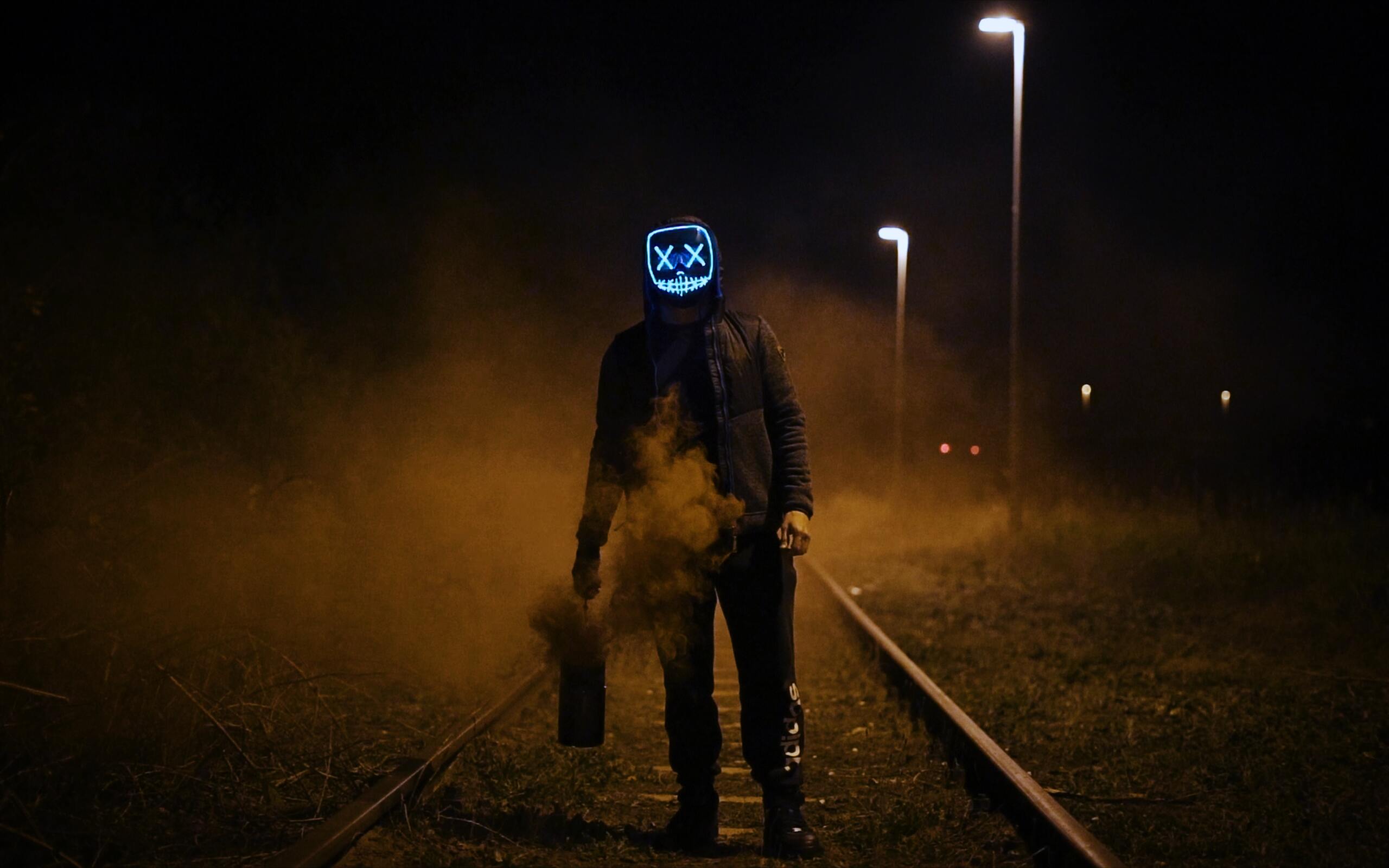 mask-guy-walking-on-railroad-tp-2560x1600.jpg