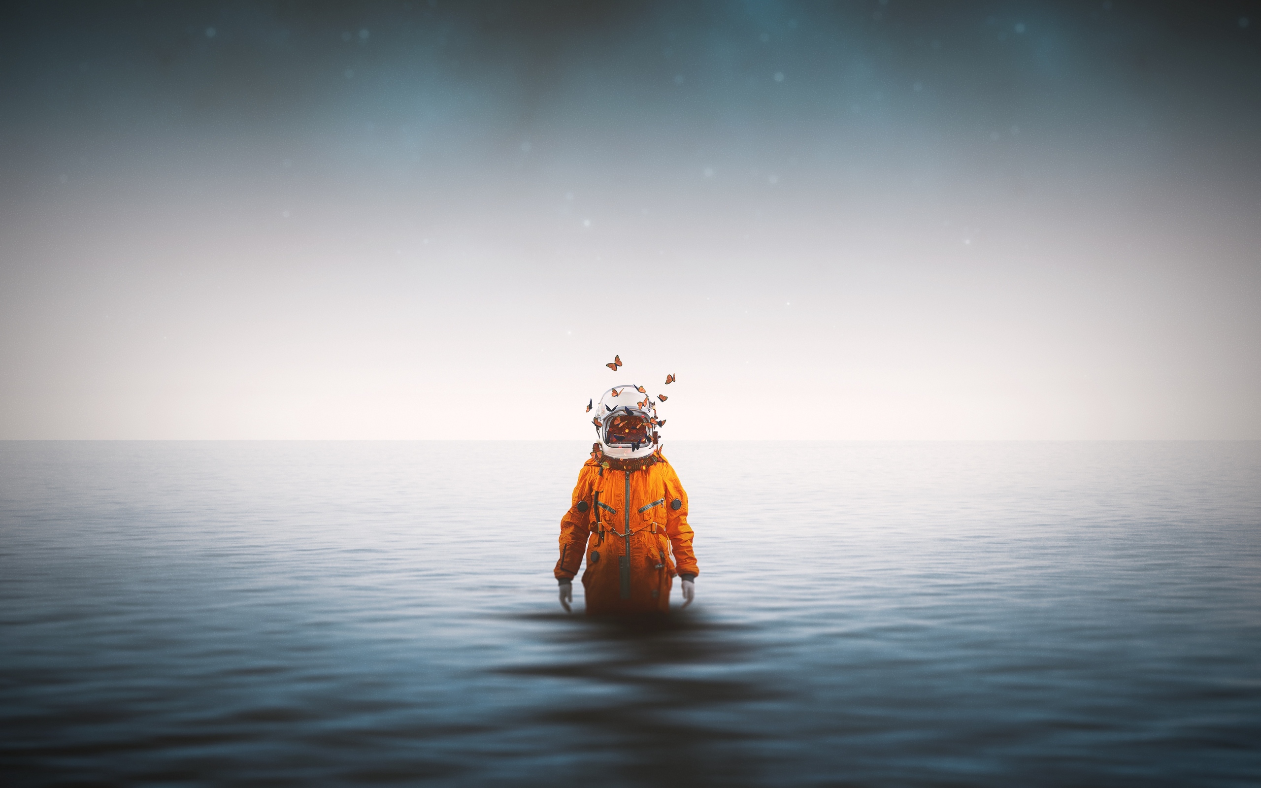 astronaut-standing-inside-ocean-butterflies-around-helmet-4k-hp-2560x1600.jpg