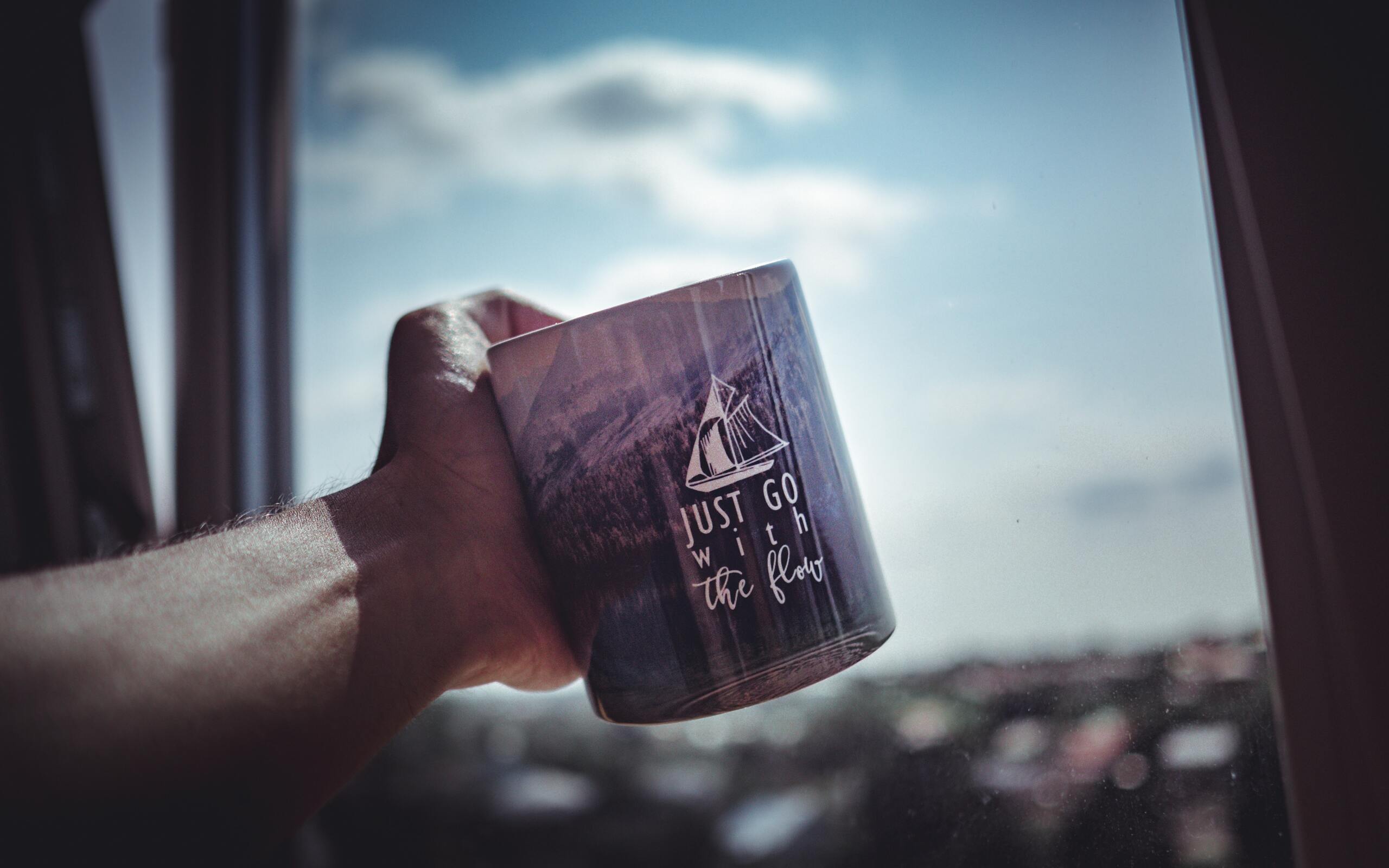 person-holding-cup-ex-2560x1600.jpg