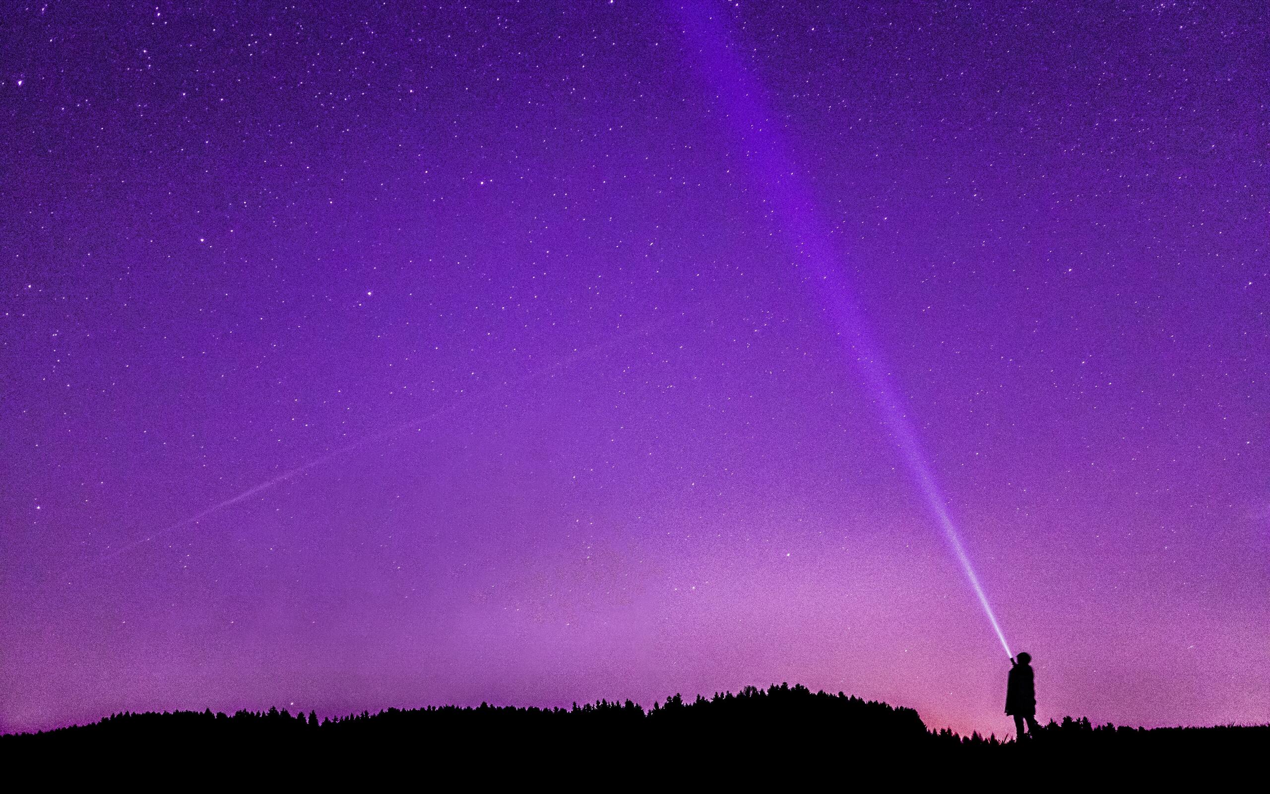 person-flashing-light-to-sky-silhouette-r1-2560x1600.jpg